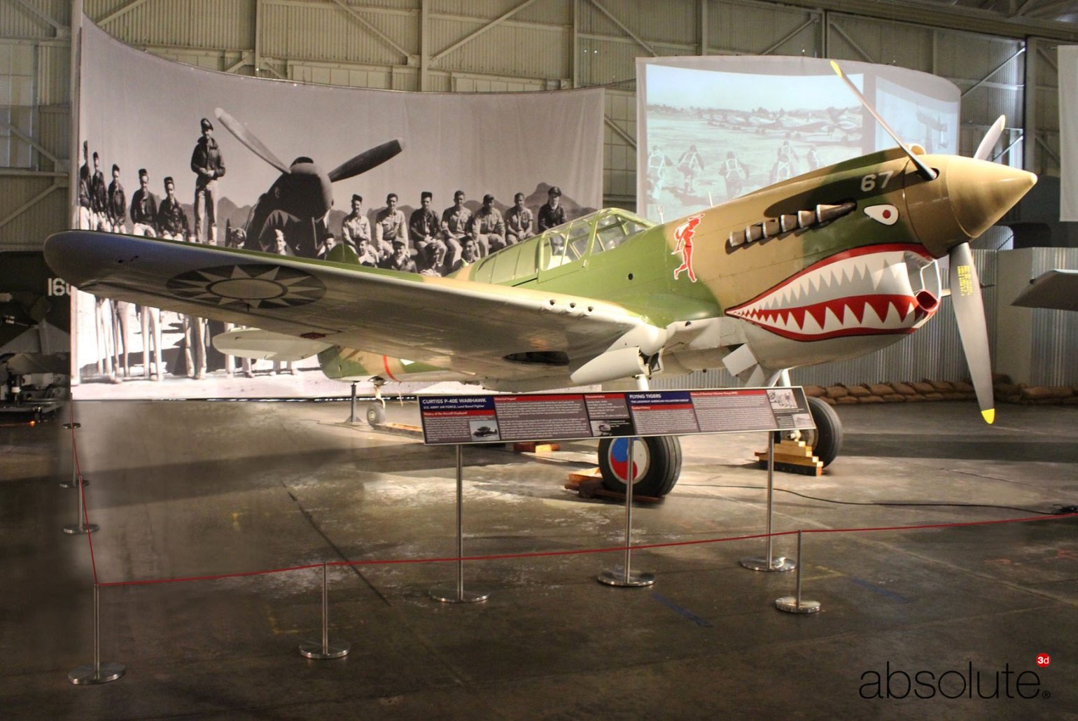 Absolute Freestanding Barrier protecting the Curtiss P-40E Warhawk (Fighter), and related information displayed on a Reader Rail. Absolute Freestanding Barrier protecting the Curtiss P-40E Warhawk (Fighter), and related information displayed on a Reader Rail.